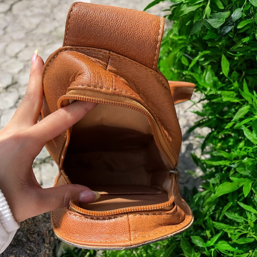 Tan tooled leather fringe sling bag