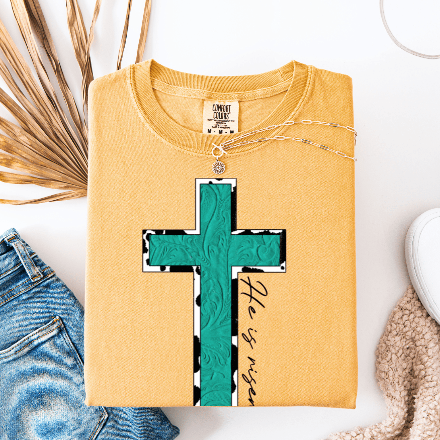 Turquoise & Cow Print He is Risen Cross Graphic Tee