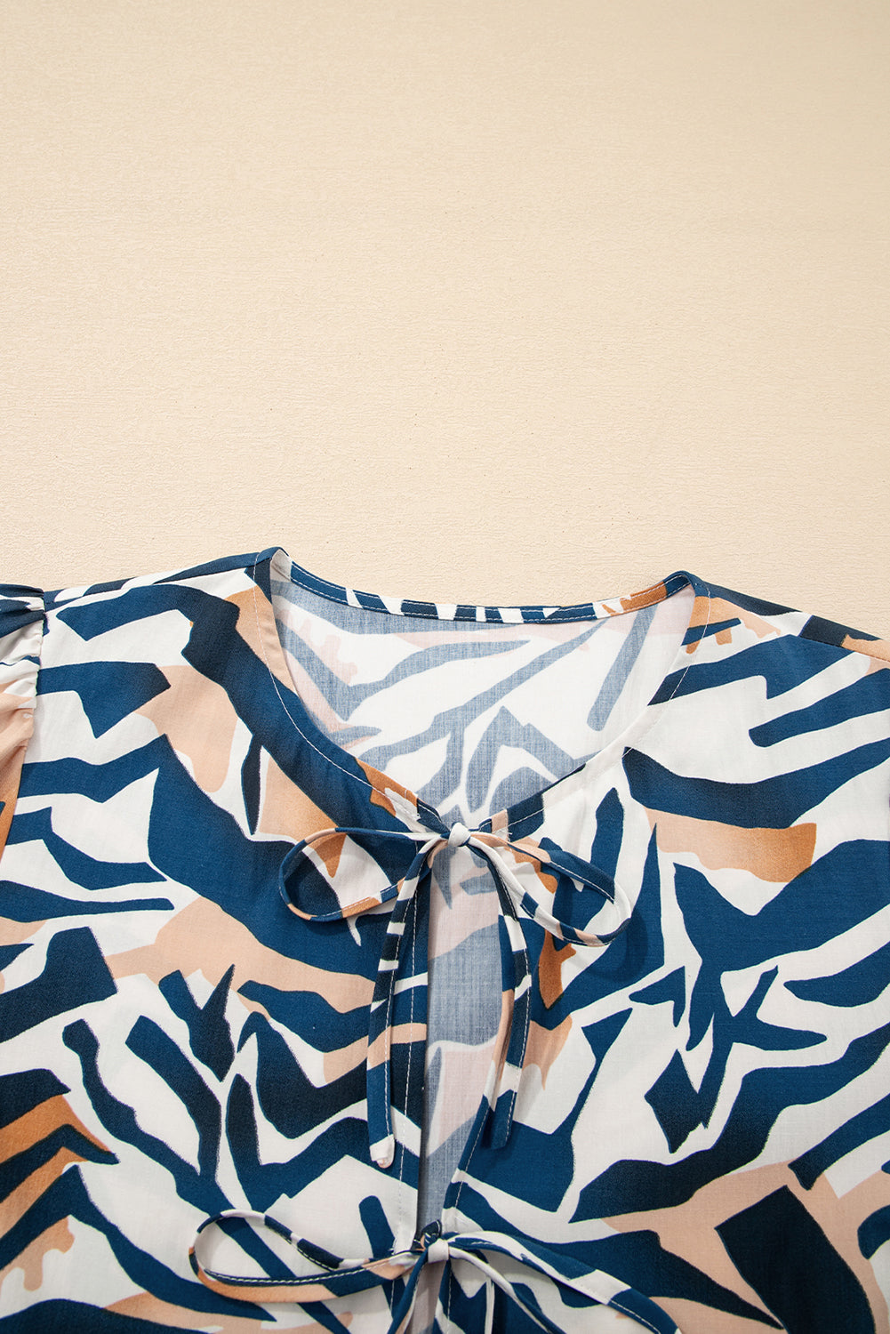 Zebra Tied Front Puff Sleeve Top