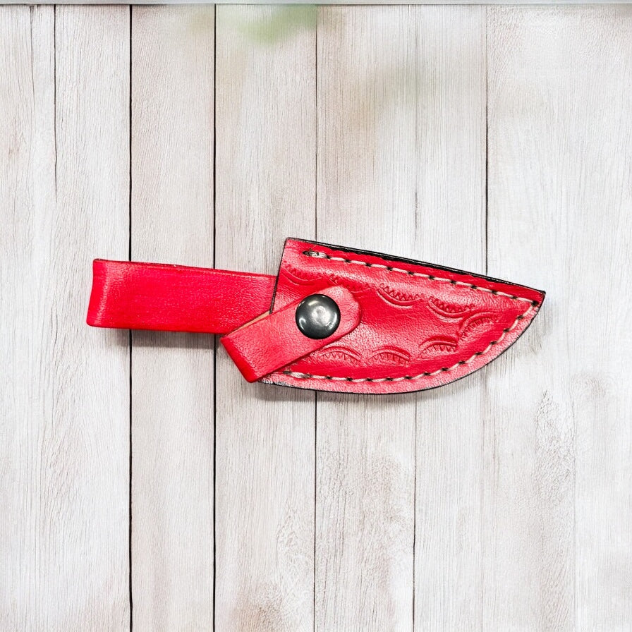 Red tooled leather sheath